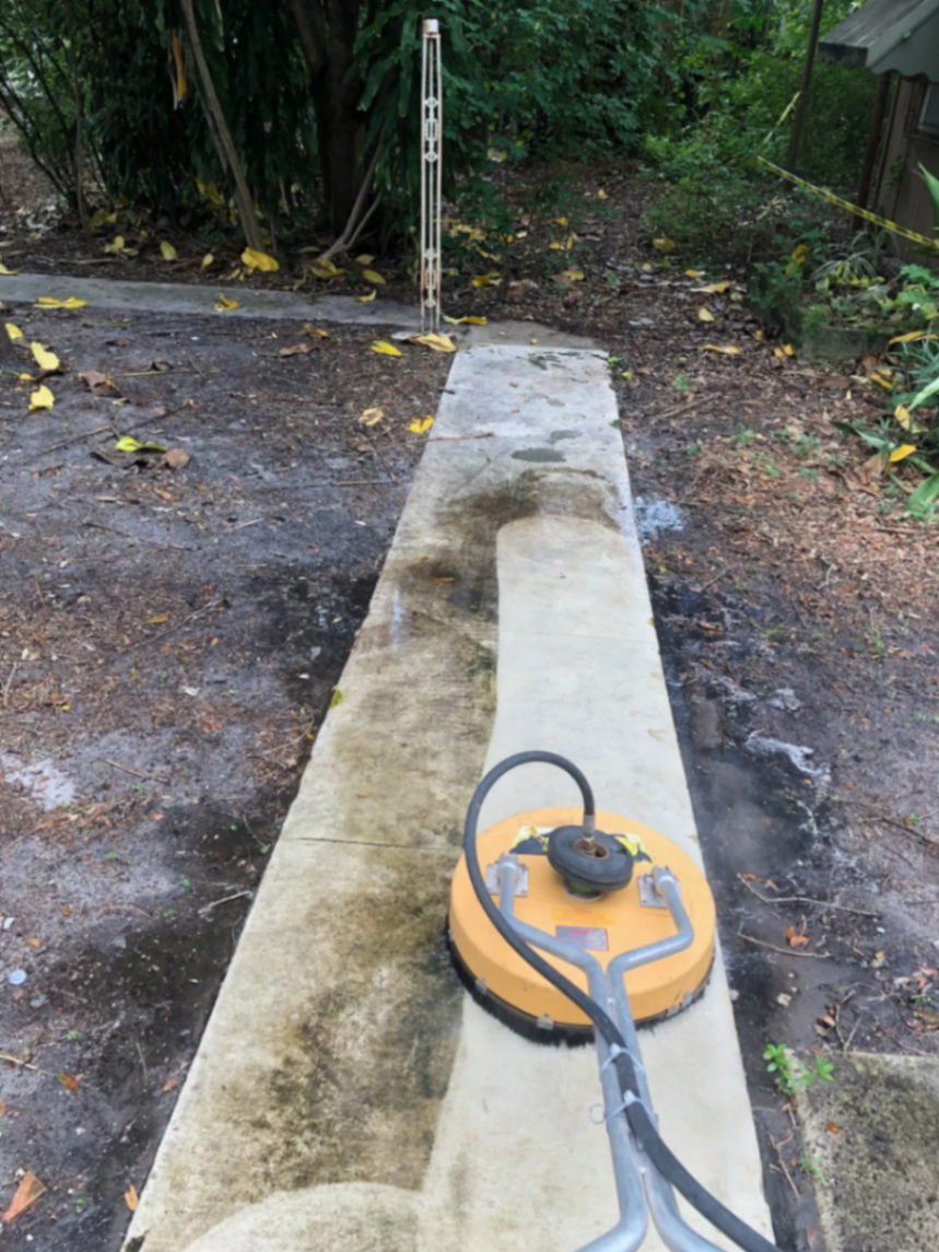 Cleaning a walkway with a surface cleaner